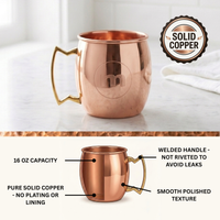 A polished copper Moscow mule mug with a gold-toned handle, shown on a light marble surface with a white towel in the background. Text overlay stating welded handle, polished finish, solid copper and 6oz capacity.
