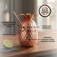 Copper pineapple shaped cocktail cup with straw setting on wood table with text overlay that states straw sold separately, diamond pattern, two piece design, and solid copper.