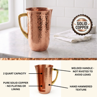 A hammered solid copper pitcher with a gold-toned handle, shown on a white countertop. A circular badge reads 'SOLID COPPER.