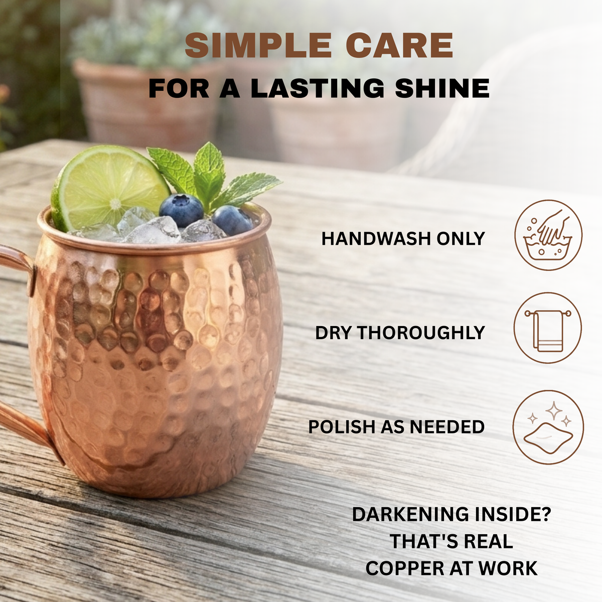 A hammered copper mug filled with a drink, ice, blueberries, and mint, placed on a wooden surface with promotional text about simple care instructions. The overlaid text says hand wash only, dry thoroughly, polish as needed.