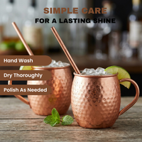 Two hammered copper Moscow mule mugs with copper straws on a wooden table, one filled with ice and lime garnish, with text overlays about simple care.