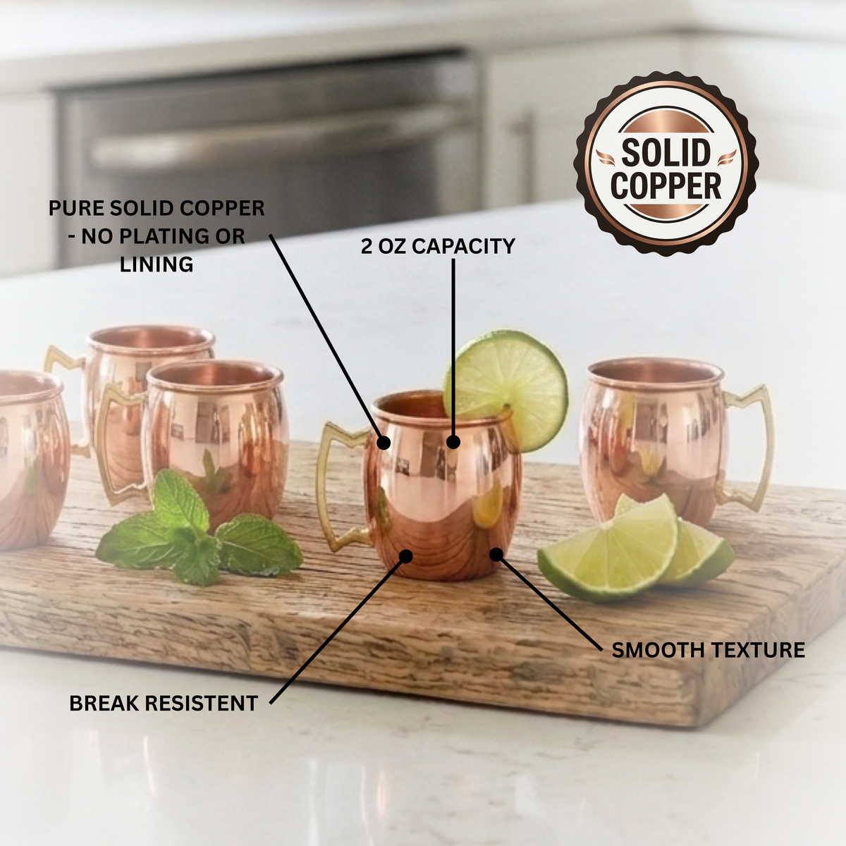 Four mini 2oz copper Moscow mule cups arranged on a wooden board with lime wedges and mint leaves, overlaid with callout labels and a circular badge reading 'Solid Copper.' 